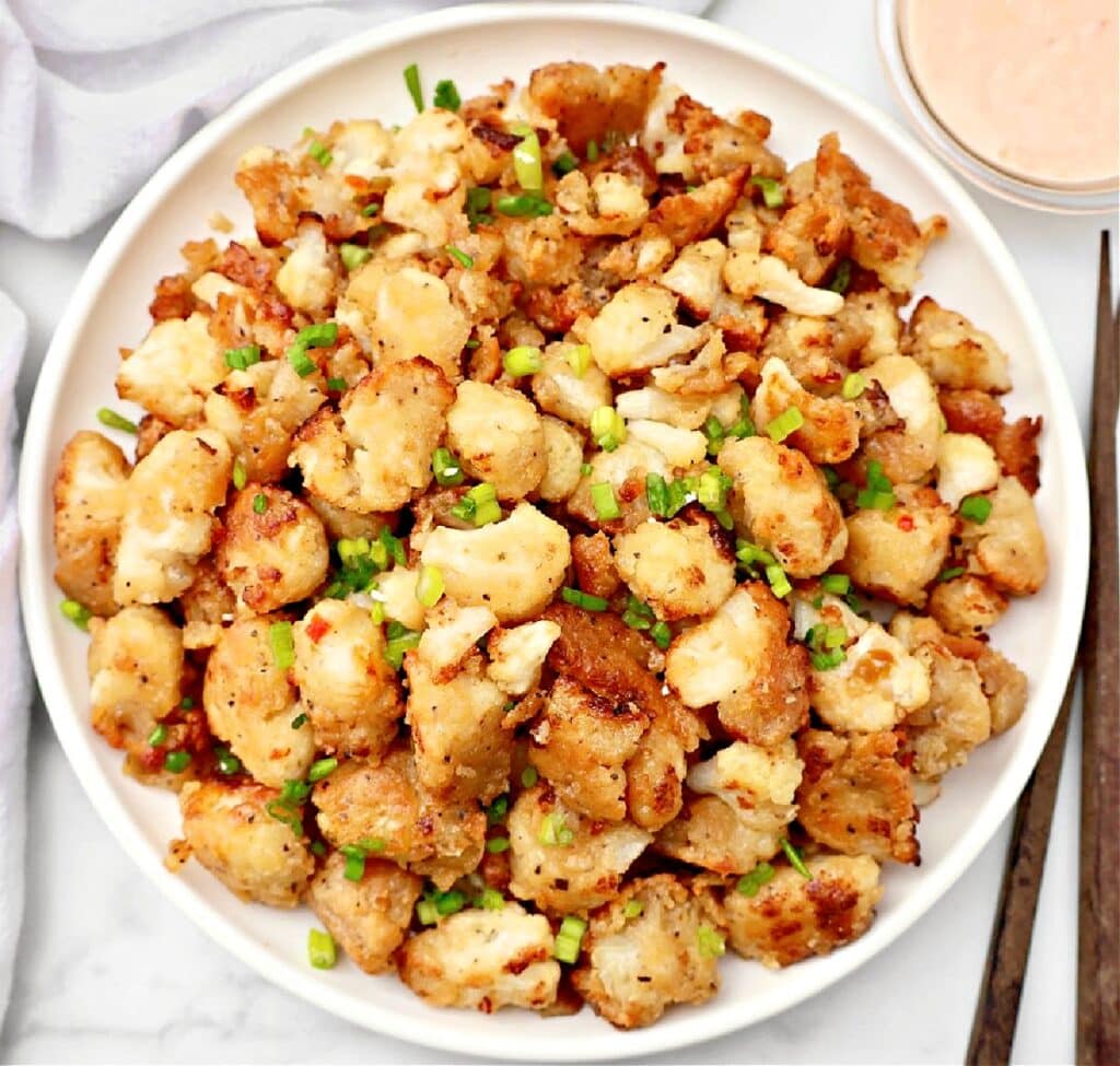 Crispy Bang Bang Cauliflower tossed in a bold, sweet, and spicy sauce. A restaurant-style dish made easy at home!