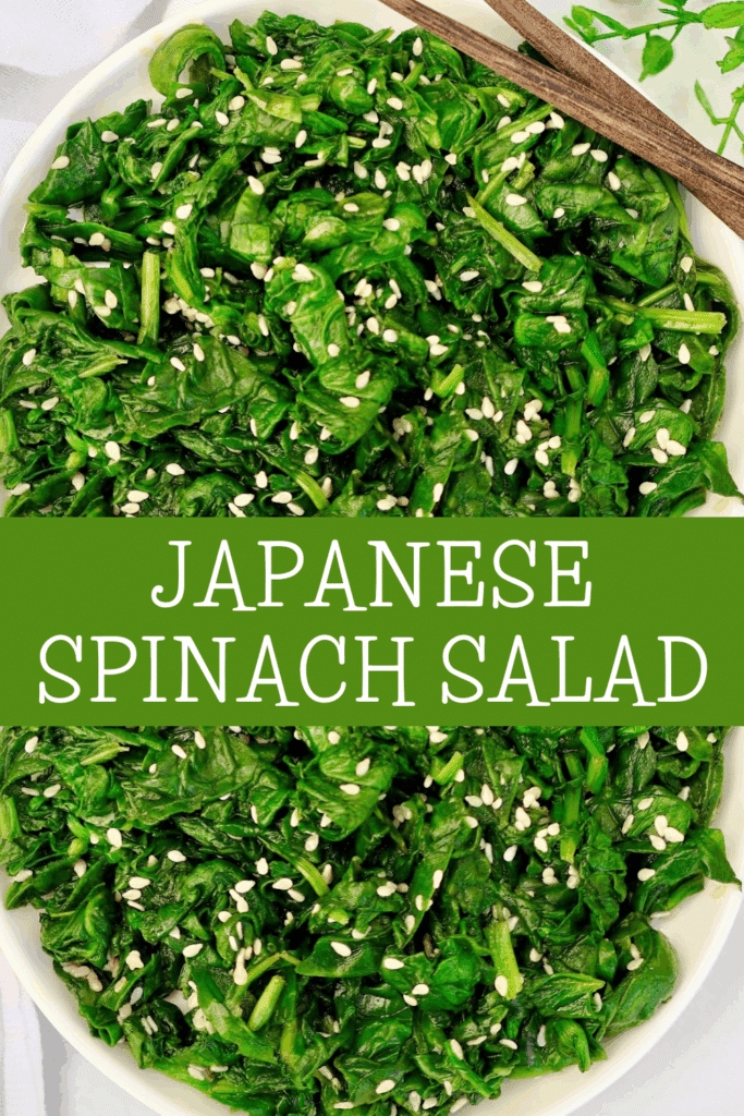 A bowl of Japanese spinach salad topped with sesame seeds, with a green banner across the middle displaying the text Japanese Spinach Salad in white letters.
