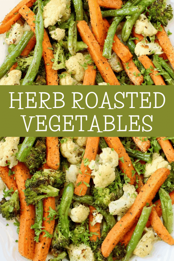 A platter of roasted vegetables including carrots, green beans, broccoli, and cauliflower, topped with herbs. Overlaid text in the center reads “HERB ROASTED VEGETABLES.”.