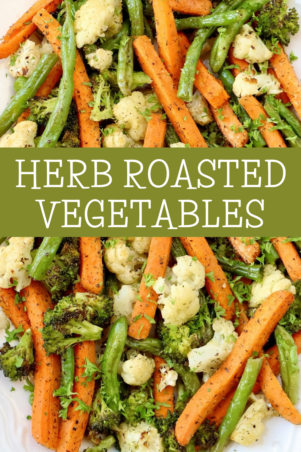 Herb Roasted Vegetables with carrots, broccoli, cauliflower, and green beans. Seasoned with dill, parsley, and garlic, then roasted until perfectly tender and flavorful — a simple, colorful side dish for everyday dinner or the holiday table. via @thiswifecooks