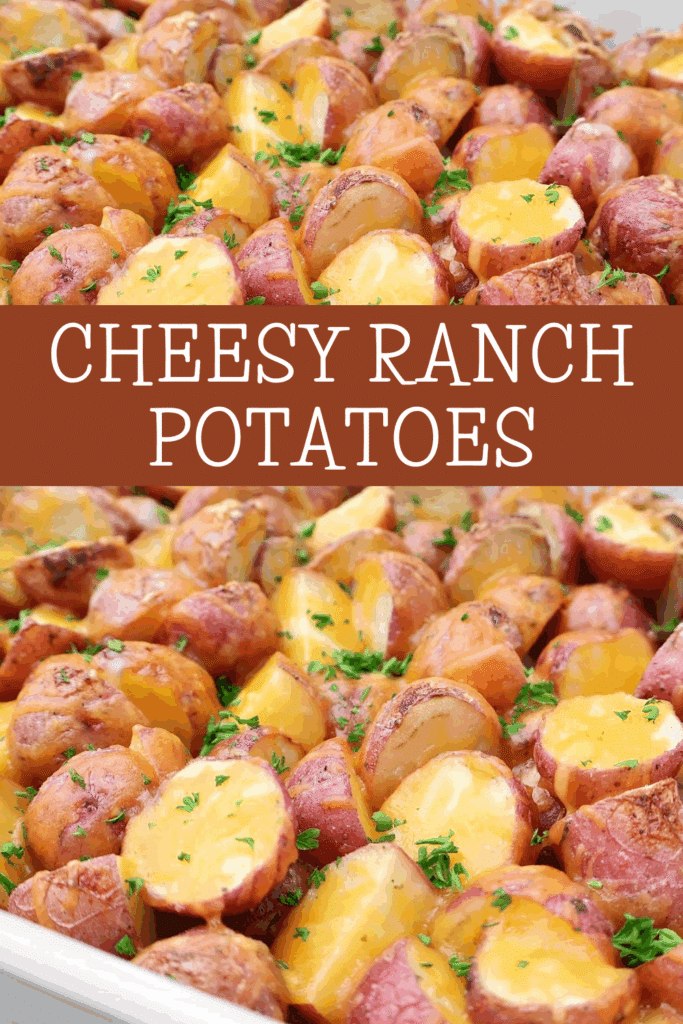 Close-up of roasted red potatoes topped with melted cheese and garnished with chopped herbs, labeled Cheesy Ranch Potatoes in bold white text across the center.