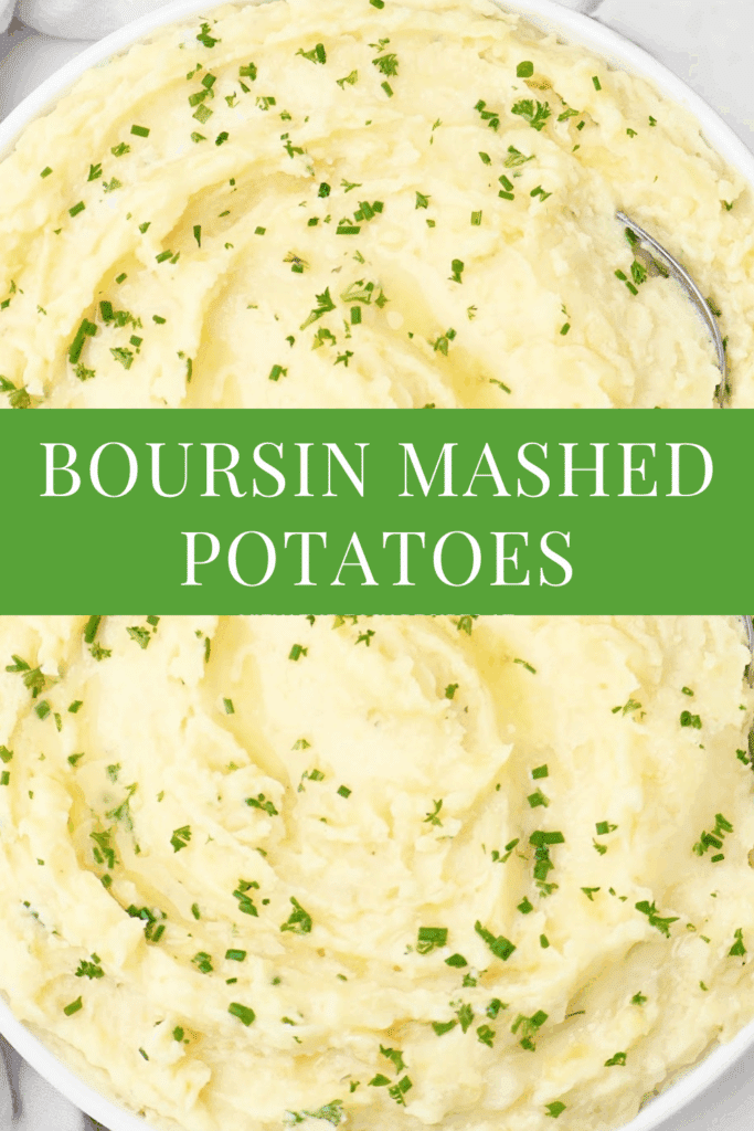 A bowl of creamy mashed potatoes topped with chopped herbs. Centered text overlay reads Boursin Mashed Potatoes in white letters on a green background. A spoon rests at the edge of the bowl.