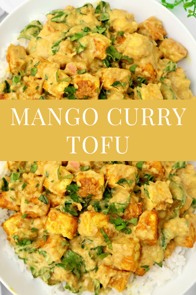 A dish of mango curry tofu served over white rice, garnished with fresh greens. The image has a text overlay in the center that reads: “Mango Curry Tofu.”.